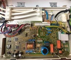 Boiler control circuit board with wiring connections during repair diagnostics