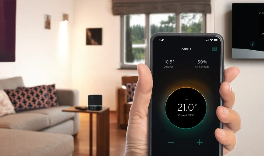 Smart thermostat app controlling home heating temperature in a modern living room.
