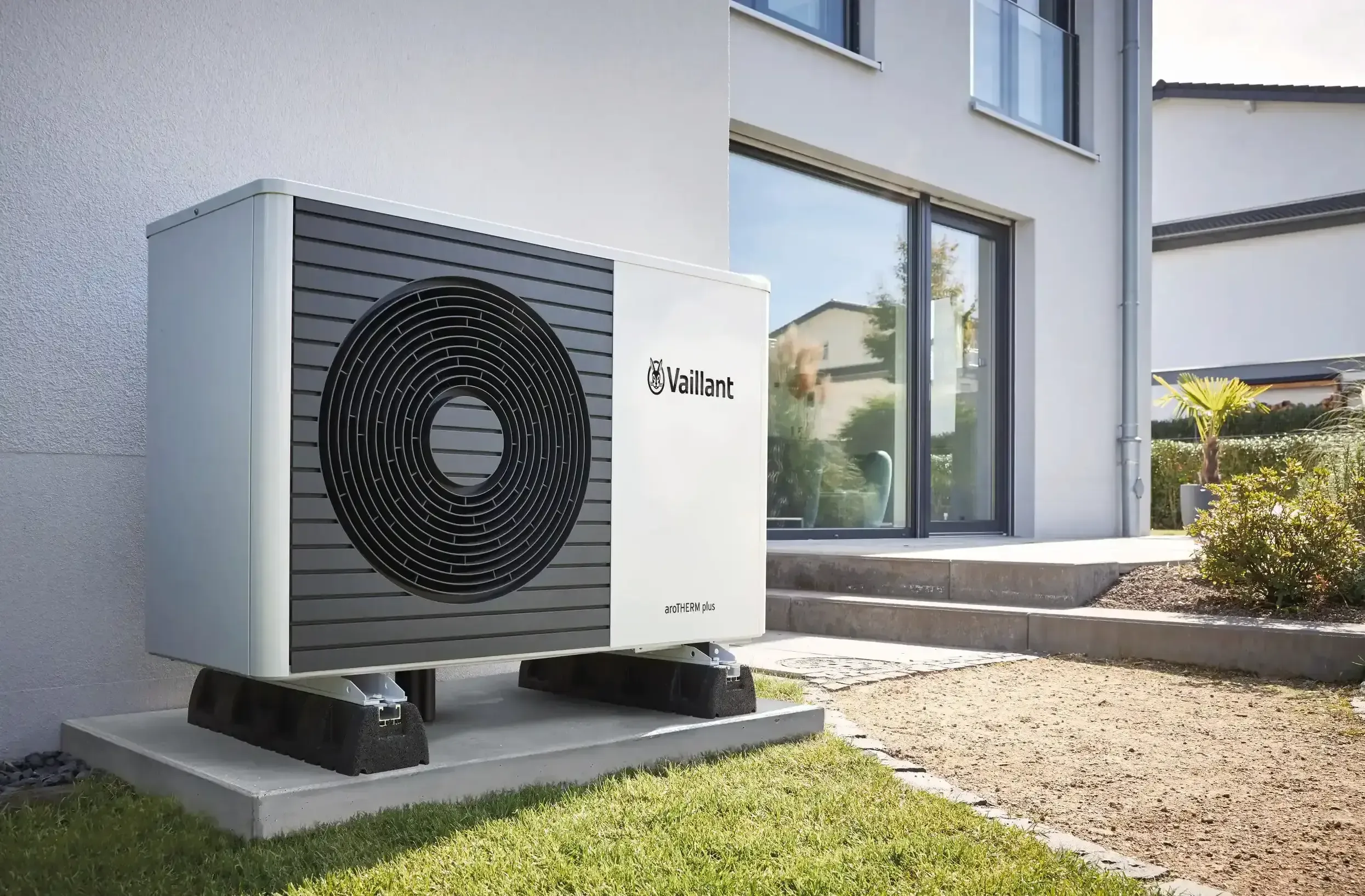 Vaillant air source heat pump installed outside a modern home for low-carbon heating.