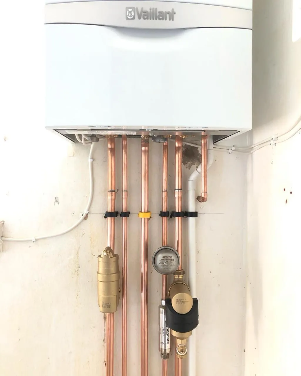 Vaillant boiler installation with copper pipework and pressure gauge in Brighton home