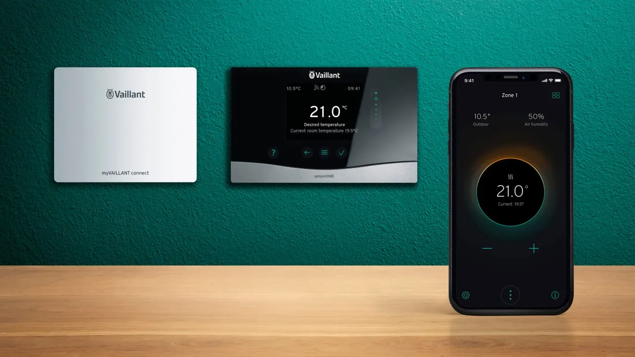 Vaillant smart thermostat and mobile app controlling home heating temperature.