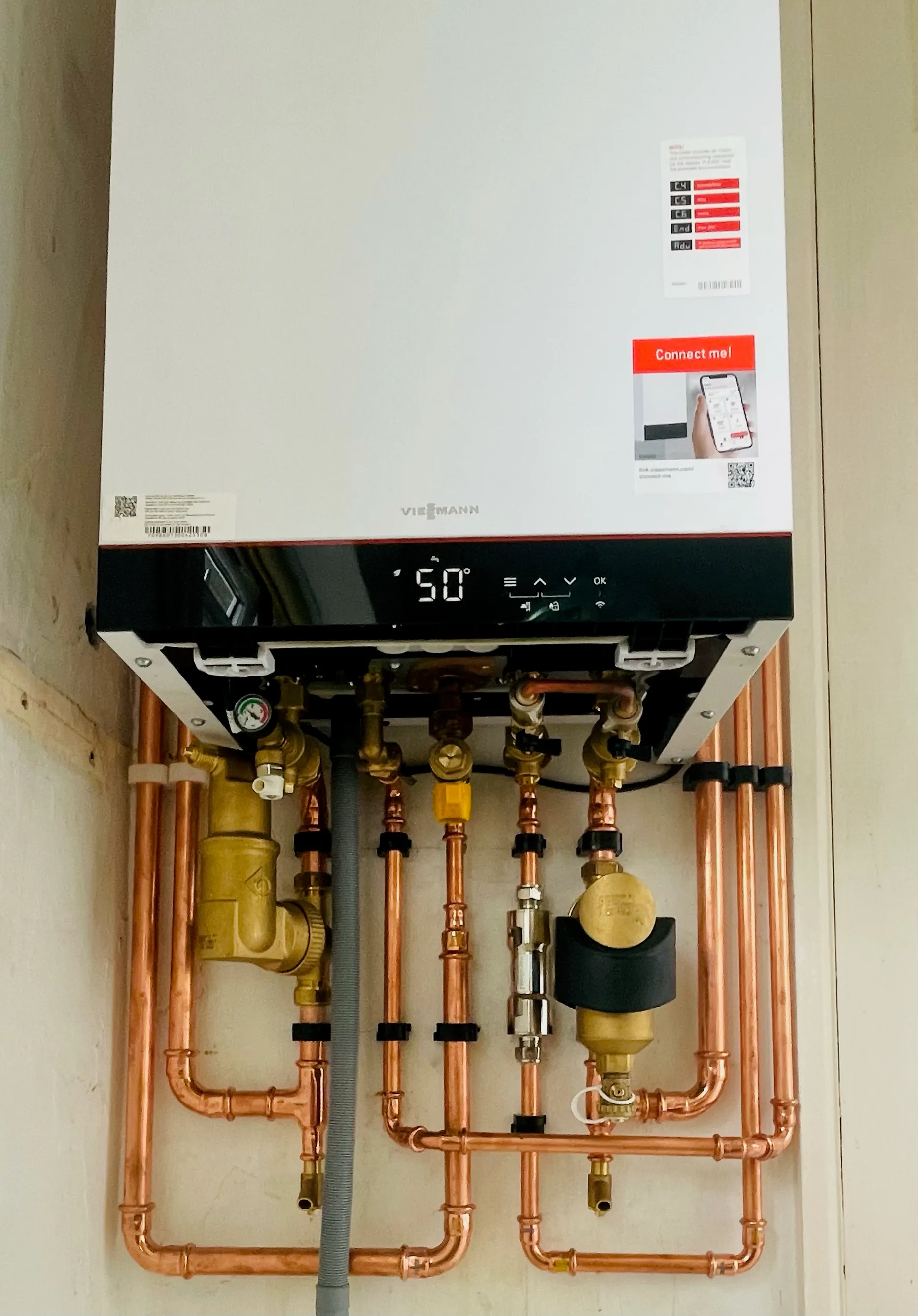Viessmann boiler installation with exposed copper pipework and controls in Brighton & Hove.